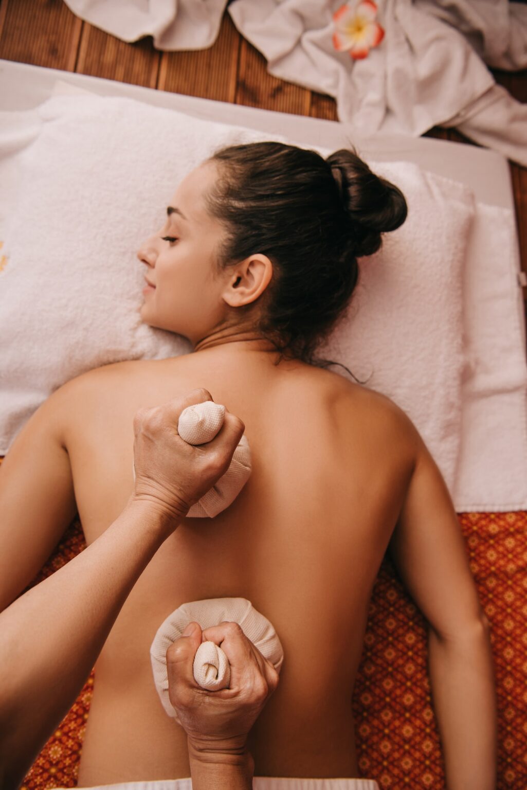Spa In Aerocity - Russian Spa In Aerocity -Russian Spa In Mahipalpur cropped view of masseur doing back massage with herbal balls to woman in spa