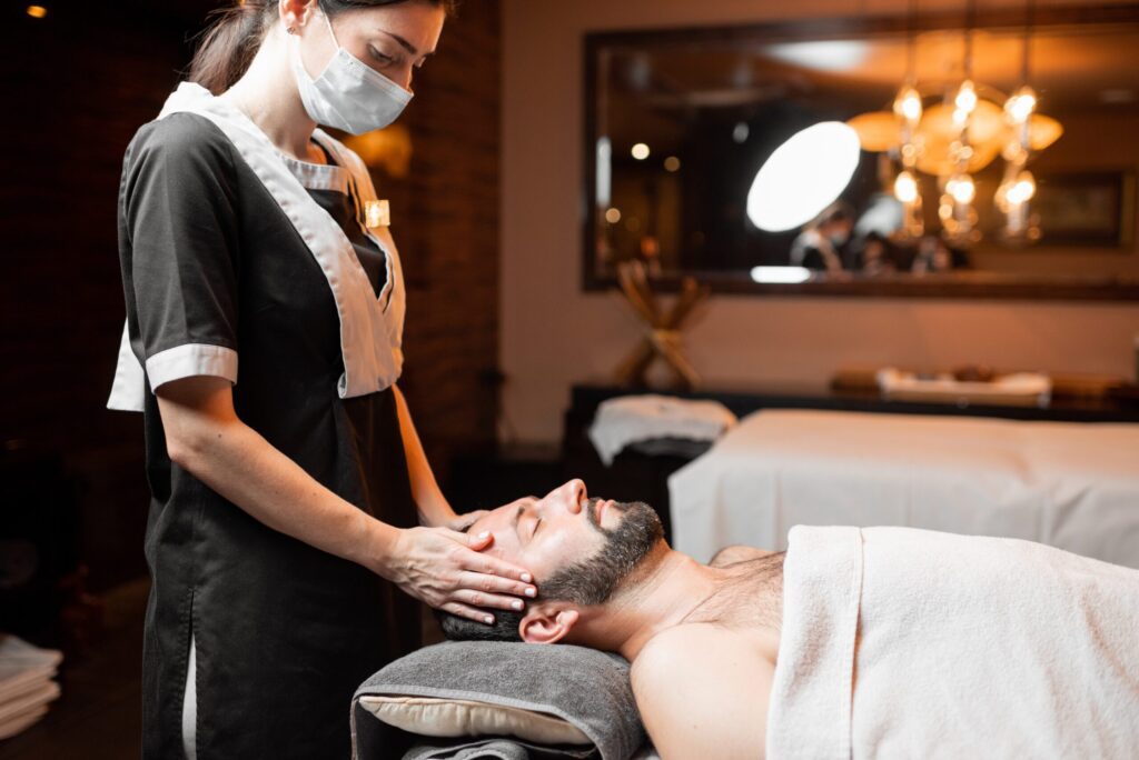 female-masseur-doing-facial- Russian Spa In GTB Nagar